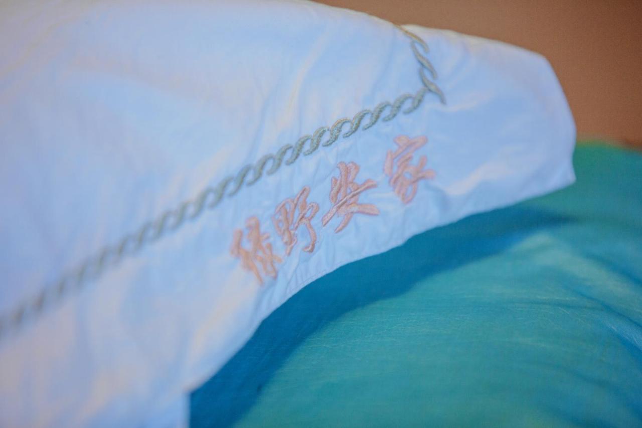 Апартаменты Lv Ye An Jia 绿野安家 Лицзян Экстерьер фото